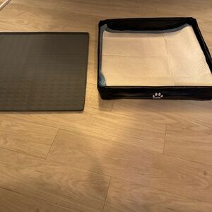 Dog potty pad holders trays bundle. One is black and one is gray.